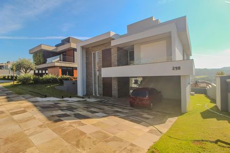 Casa de condomínio à venda com 286m², 4 quartos e 4 vagas Casa de condomínio à venda com 286m², 4 quartos e 4 vagasFachada/Garagem
