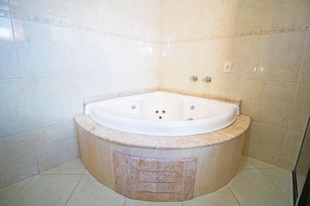 Casa à venda com 450m², 4 quartos e 4 vagas Casa à venda com 450m², 4 quartos e 4 vagasBanheiro da Suíte 1
