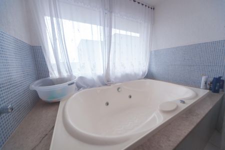 Casa de condomínio à venda com 540m², 4 quartos e 5 vagasBanheiro suite 3