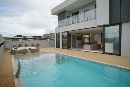 Casa de condomínio para alugar com 442m², 6 quartos e 3 vagasÁrea externa