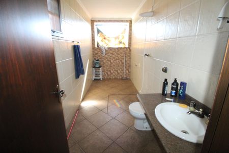 Casa de condomínio para alugar com 327m², 6 quartos e 4 vagasBanheiro da Suíte 2