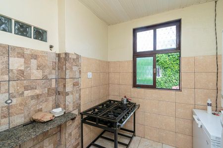 Casa à venda com 560m², 5 quartos e 6 vagasCasa frente - Cozinha