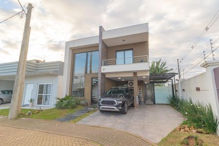 Fachada de casa de condomínio à venda com 4 quartos, 168m² em Fátima, Canoas