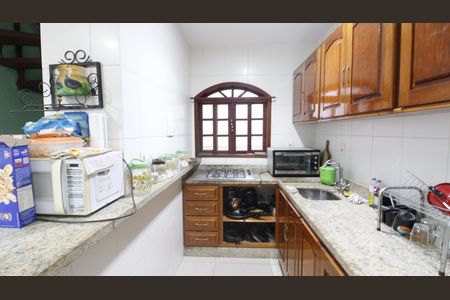 Casa de condomínio para alugar com 220m², 4 quartos e 2 vagasCozinha