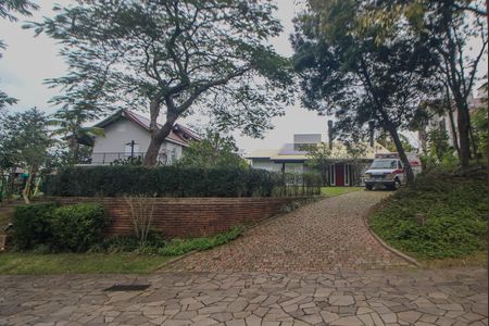 Fachada de casa de condomínio para alugar com 4 quartos, 840m² em Cavalhada, Porto Alegre