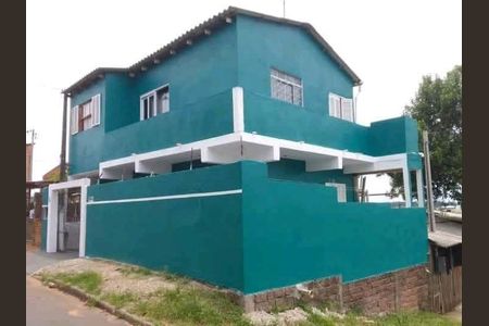 Fachada de casa à venda com 2 quartos, 120m² em Guajuviras, Canoas