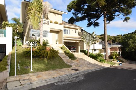 Casa de condomínio para alugar com 346m², 4 quartos e 4 vagasFachada