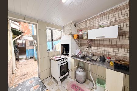 Casa à venda com 146m², 4 quartos e sem vagaCozinha e churrasqueira da Edícula