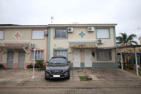 Fachada de casa de condomínio à venda com 2 quartos, 102m² em Humaitá, Porto Alegre