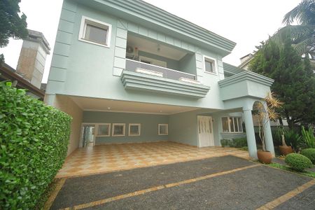 Casa de condomínio para alugar com 420m², 4 quartos e 6 vagasGaragem/Fachada 