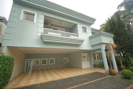 Casa de condomínio para alugar com 420m², 4 quartos e 6 vagasGaragem/Fachada 