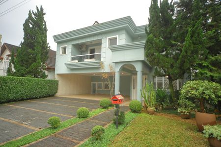 Casa de condomínio para alugar com 420m², 4 quartos e 6 vagasGaragem/Fachada 