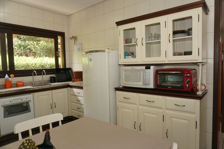 Casa de condomínio para alugar com 300m², 4 quartos e 2 vagasCozinha